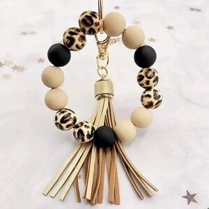 Animal print bracelet with key ring and tassel